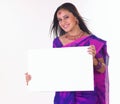 Indian teenage girl holding the white placard