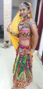 Indian teenage girl ready for garba dance, where a pug is seeing her different look