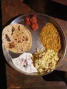 Indian thali serving dinner, containing chapati, lentil soup, rice etc Royalty Free Stock Photo