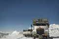 Indian and tibetan drive car and truck on Khardung La Road in Himalaya mountain at Leh Ladakh in Jammu and Kashmir, India