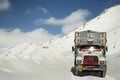 Indian and tibetan drive car and truck on Khardung La Road in Himalaya mountain at Leh Ladakh in Jammu and Kashmir, India