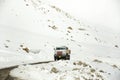 Indian and tibetan drive car and truck on Khardung La Road in Himalaya mountain at Leh Ladakh in Jammu and Kashmir, India