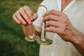 Indian tingsha bells for meditation and yoga in the hands of a man, sound vibrations for healing and relaxing 1 Royalty Free Stock Photo