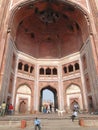 Indian tourists explore the courtyard and palaces