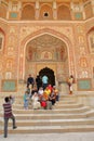 Indian tourists taking family pictures at Ganesh Pol, main entrance gate to Amber Fort