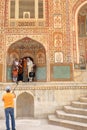 Indian tourists taking family pictures at Ganesh Pol, main entrance gate to Amber Fort