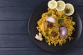 Biryani with chicken. Traditional Indian dish of rice and chicken, with spices and lemon. Royalty Free Stock Photo