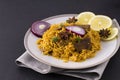 Biryani with chicken. Traditional Indian dish of rice and chicken, with spices and lemon. Royalty Free Stock Photo