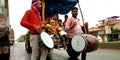 indian traditional drummer plying music on road during Hindu religious festival in India oct 2019 Royalty Free Stock Photo