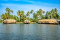 Indian traditional house boats anchored at Pamba river coastline, with palms at the background, Alappuzha, Kerala, South India Royalty Free Stock Photo