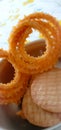 Indian traditional snacks Salty chakli and sweet biscuits Royalty Free Stock Photo