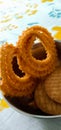 Indian traditional snacks Salty chakli and sweet biscuits Royalty Free Stock Photo