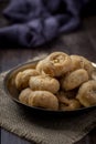 Indian traditional sweet balushahi served on a metal plate on wooden background Royalty Free Stock Photo