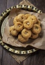 Indian traditional sweet balushahi served on a metal plate on wooden background Royalty Free Stock Photo