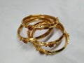 Indian Traditional Women Wear Gold Bangles or Bracelets on white background