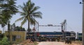 Indian train passing a level crossing Royalty Free Stock Photo