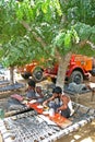 Indian truck drivers eating out on the roadside restaurants in highways with their trucks.