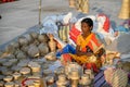 An Indian unidentified woman preparing bamboo carving artwork of bamboo sticks items for sale in Kolkata in handicrafts trade fair