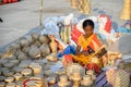 An Indian unidentified woman preparing bamboo carving artwork of bamboo sticks items for sale in Kolkata in handicrafts trade fair