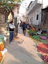 Traditional Indian vegetable market people purchasing vegetables from green grocer in Rajasthan Jaipur sanganer