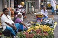 Indian vegetable seller at food market in India. Small vegetable & fruit vendors are sold in road side shops through Indian cities