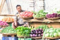 Indian vegetable seller at food market in Varanasi, India