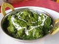 Indian vegetarian dish of paneer cheese in a thick paste of mashed spinach with various spices Royalty Free Stock Photo