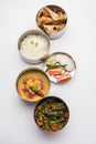 Indian Lunch box or tiffin - Spicy Ladies Finger, dal fry, rice and chapati Royalty Free Stock Photo