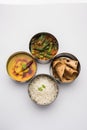 Indian Lunch box or tiffin - Spicy Ladies Finger, dal fry, rice and chapati