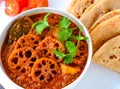 Indian vegetarian meal - lotus stem curry with roti Royalty Free Stock Photo