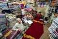 Indian vendors selling saris in a textile store