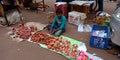 an indian village boy selling soil made devotional object during diwali festival in India