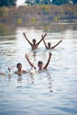 Indian village boys swimming in the fresh river water.