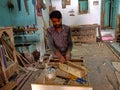 an indian village carpenter making wooden furniture at factory in India January 2020