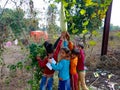 indian village childrens holded fresh green pumpkin at green field area in India January 1, 2020