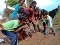 indian village childrens plying Gilli danda game together at village area in India January 1, 2020