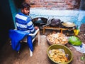an indian village cook making floar fried meal for hindu traditional occasion at courtyard in India dec 2019 Royalty Free Stock Photo