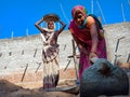 indian village female labour holded spade handle on construction site in India January 2020 Royalty Free Stock Photo