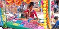 an indian village girl selling colors during diwali festival in India Oct 2019