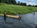 Indian village kids enjoying with their handmade Banana boat on the summer time at Tinsukia, Assam, India on 21st June 2019