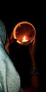 An indian village lady Worshipping in karwa chowth at night