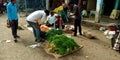 An indian village man buying vegetable from street vendor