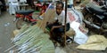 an indian village man selling brooms on street during diwali festival in India Oct 2019