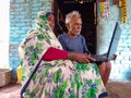 indian village matured couple operating laptop computer system at home in india January 2020 Royalty Free Stock Photo