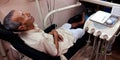 an indian village old man lying on dental chair at clinic in india aug 2019