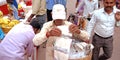 an indian village old man selling cotton for lamp during diwali festival