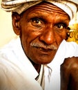 Indian village old man with wrinkles in deep thinking