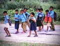 Indian village school children smiling and laughing going school poor kids of India in happy mood mid day meal right to education Royalty Free Stock Photo