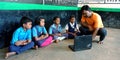 An Indian village school, computer teacher educating students about computer Royalty Free Stock Photo