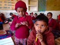 indian village school kid biting pencil at classroom in india January 2020 Royalty Free Stock Photo